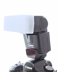 on-camera flash fitted with a diffuser